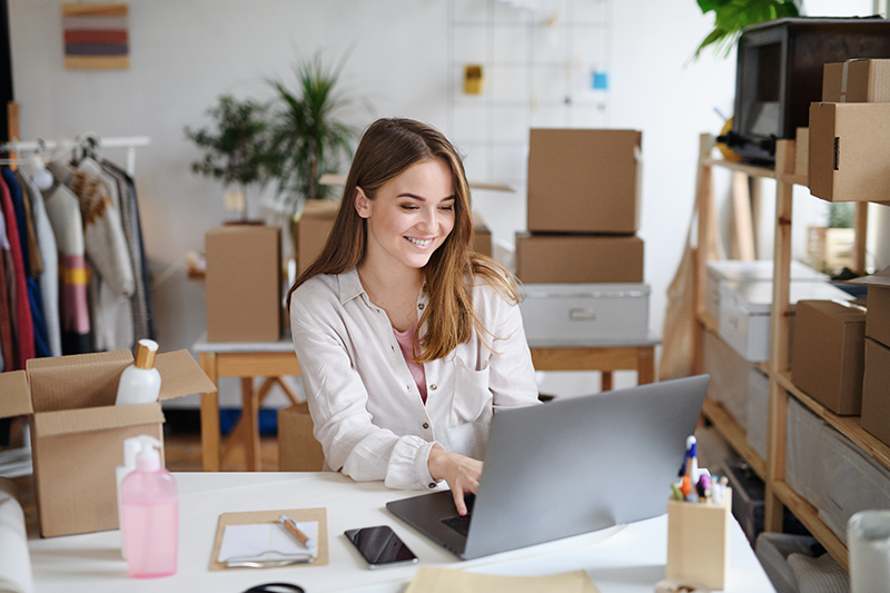 young-woman-dropshipper-with-laptop-working-at-hom-WEVGR76.png